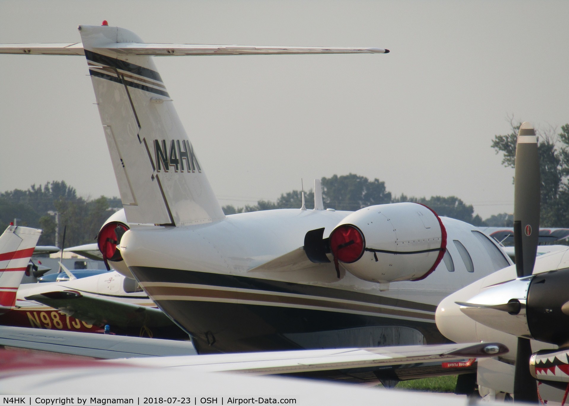 N4HK, 1994 Cessna 525 CitationJet CJ1 C/N 525-0049, typical crowded apron at EAA