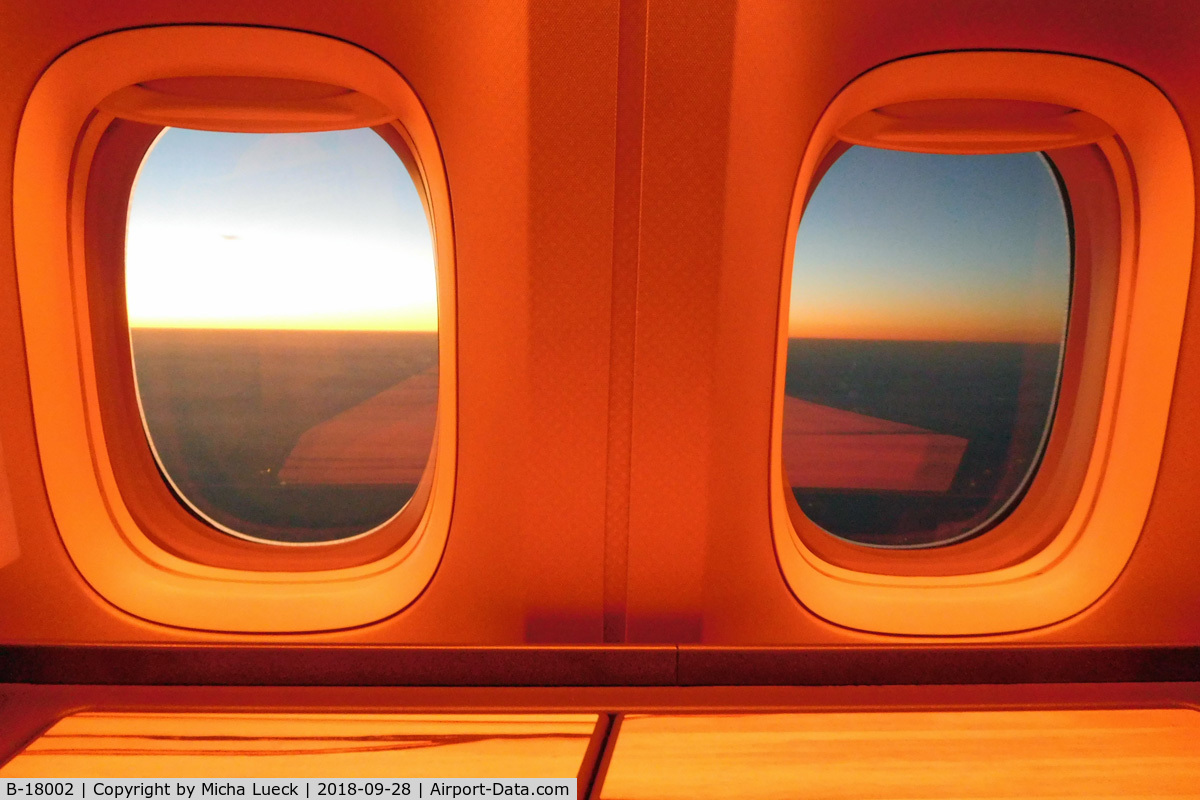 B-18002, 2015 Boeing 777-309/ER C/N 43980, Sunrise and mood lighting (TPE-FRA)