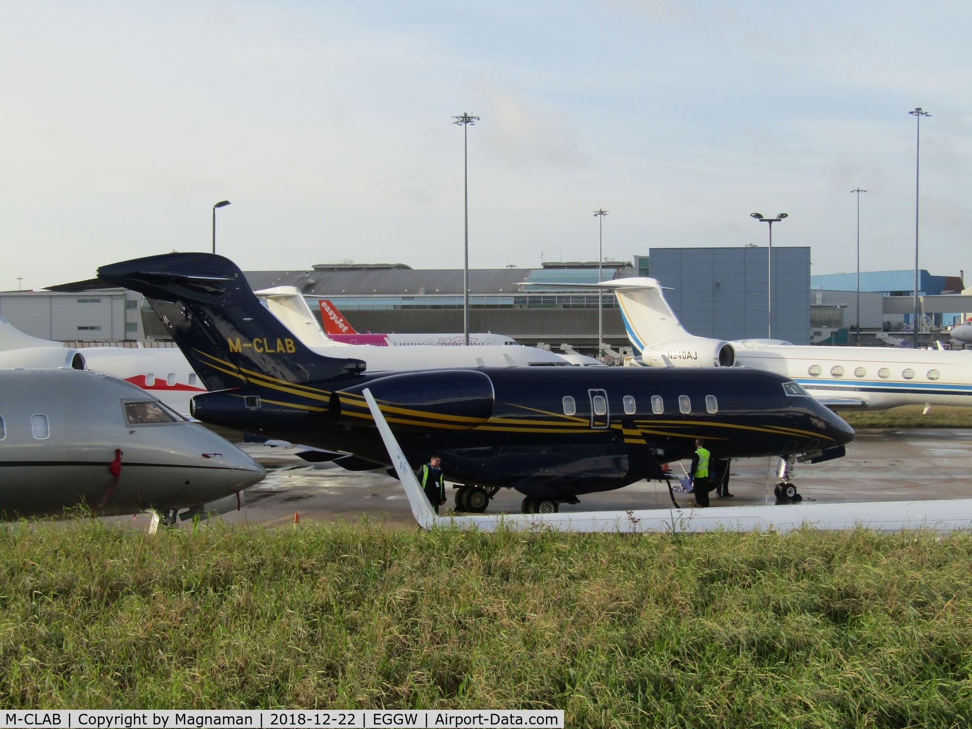 M-CLAB, 2009 Bombardier Challenger 300 (BD-100-1A10) C/N 20271, on apron at LTN