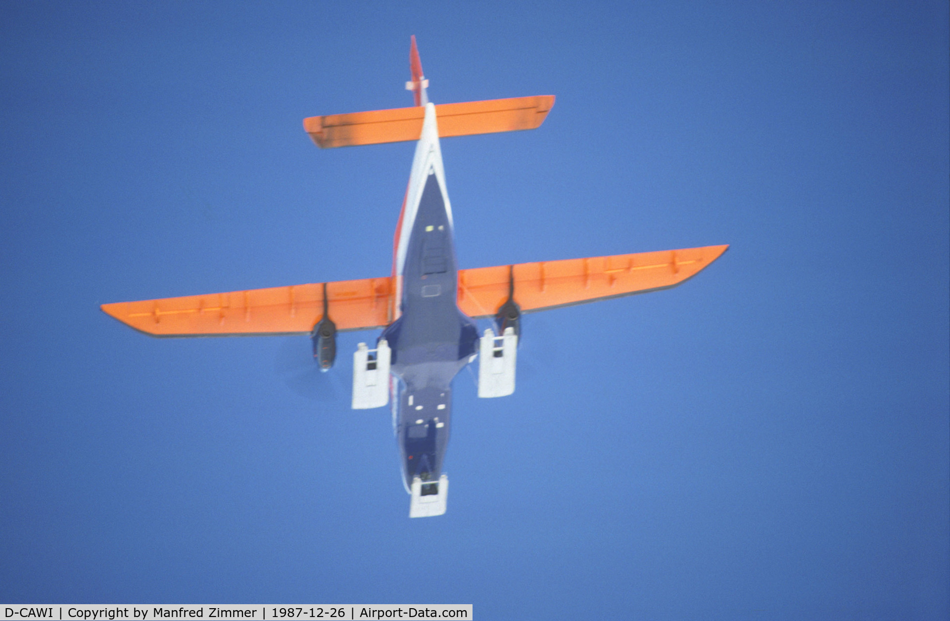 D-CAWI, 1983 Dornier 228-101 C/N 7014, POLAR 2 D-CAWI viewed from below flying POLAR 4 D-CICE during flight from Puerto Williams SCGZ (Chile) to british antarctic station Rothera. The wheels of the landing gears are positioned on movable plates of the ski for landing on snow.