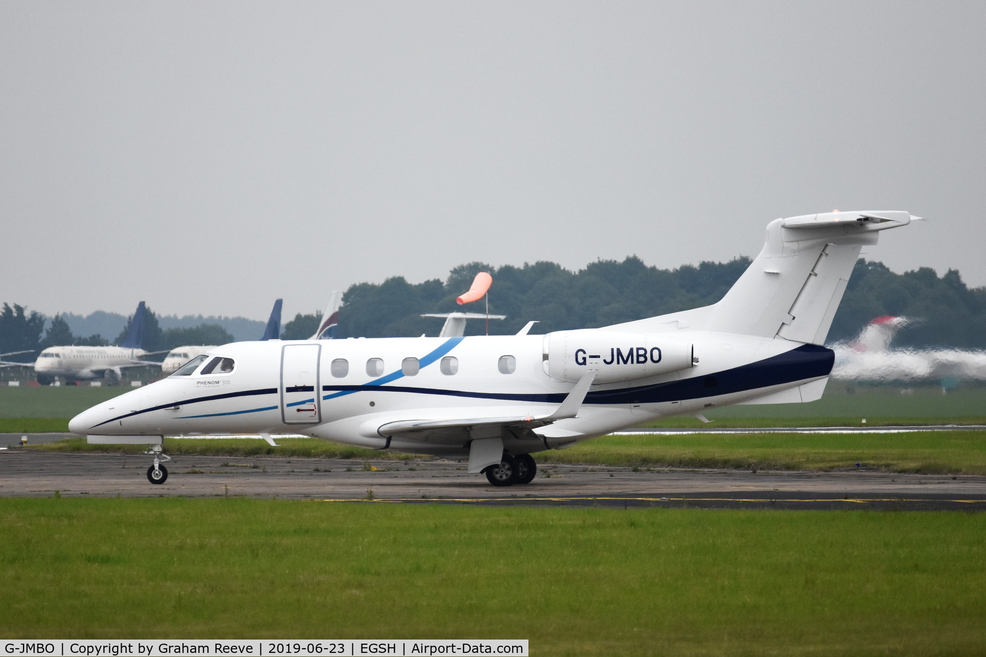 G-JMBO, 2016 Embraer EMB-505 Phenom 300 C/N 50500366, Departing from Norwich.