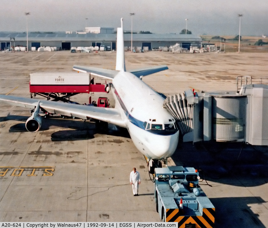 A20-624, 1968 Boeing 707-338C C/N 19624, RAAF 33 Squadron Boeing 707-338C(KC) A20-624 (in original White livery) awaiting passengers at Stansted Airport UK on 14Sep1992. Catering supplies are being loaded at rear, before a 7.7 hour flight to Dulles Washington KIAD.