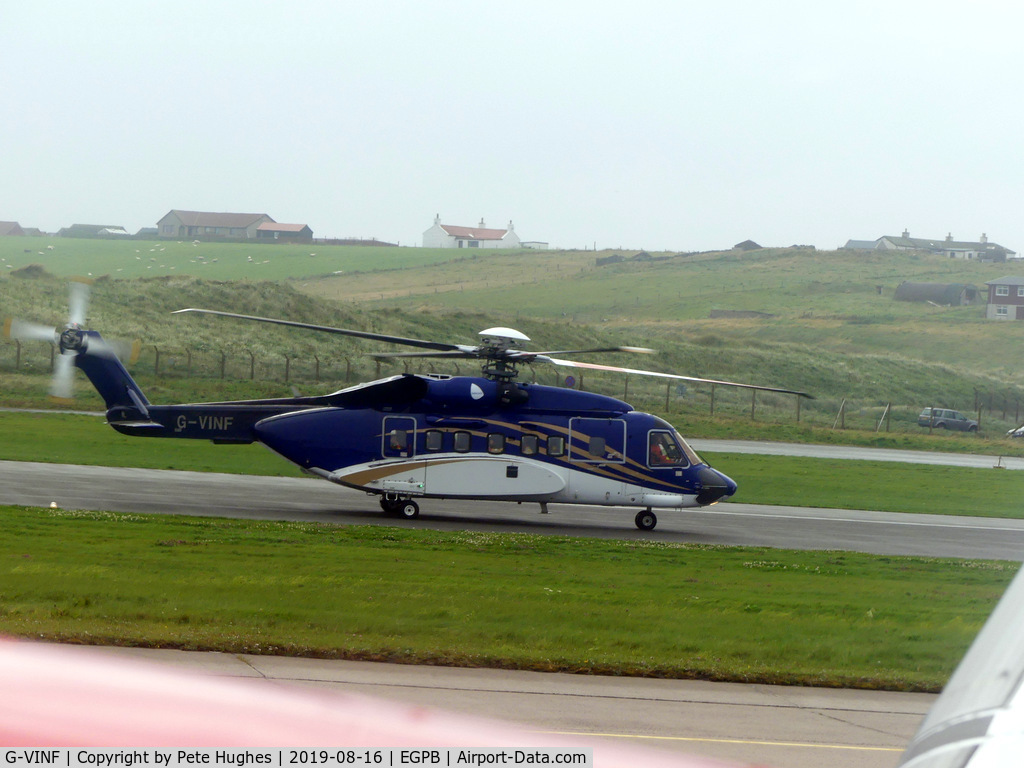 G-VINF, 2004 Sikorsky S-92A C/N 920008, G-VINF Sikorsky S92 seen from the window of G-LGNA on departure from Sumburgh, Shetland