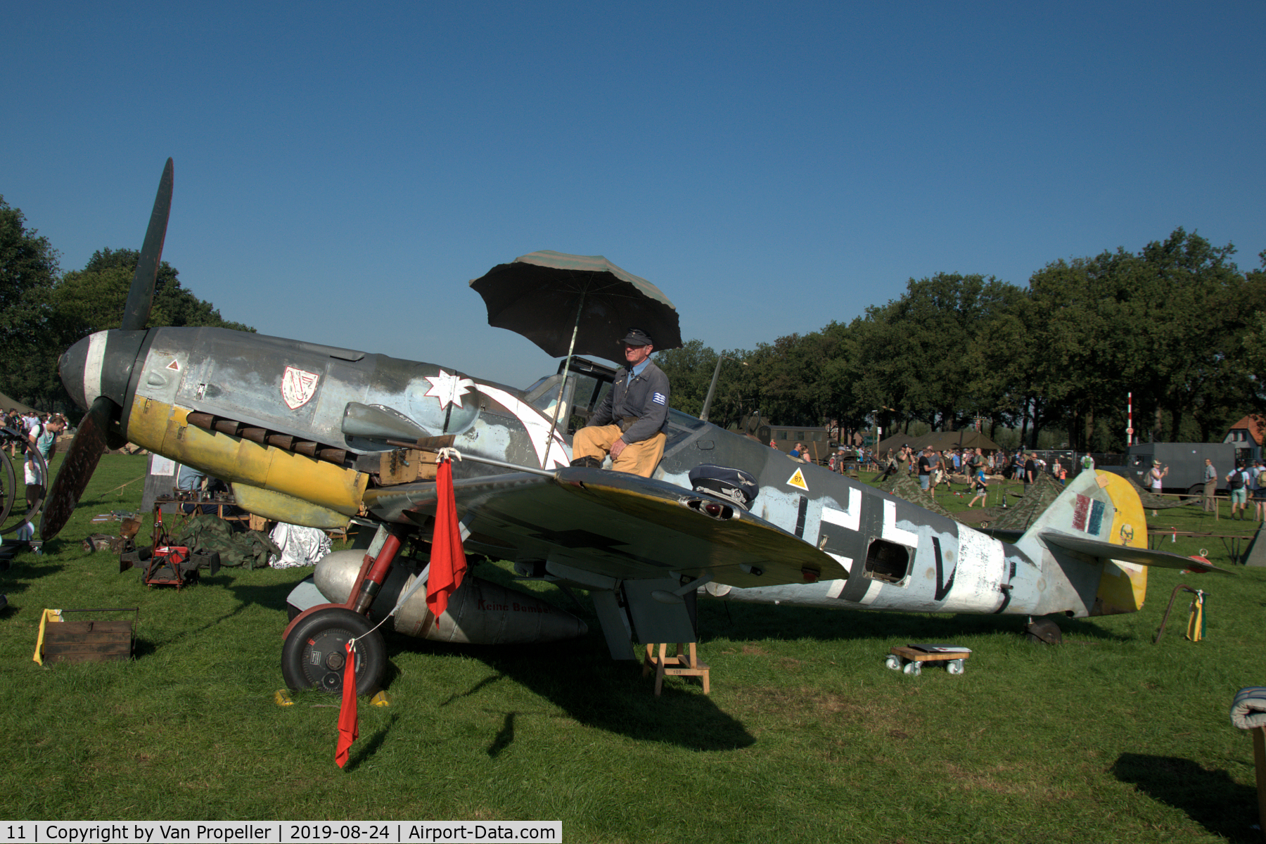 11, Messerschmitt Bf-109G-5 C/N 15343, Restored Messerschmitt Bf 109G-5 at a temporary airfield in a meadow near Ede, the Netherlands. Wings of Freedom air show, 2019. Re-enactor on the wing