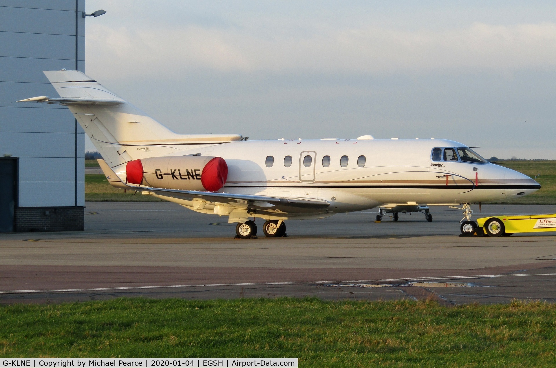 G-KLNE, 2011 Hawker Beechcraft 900XP C/N HA-0186, Parked on the company apron during a sunny winter evening.