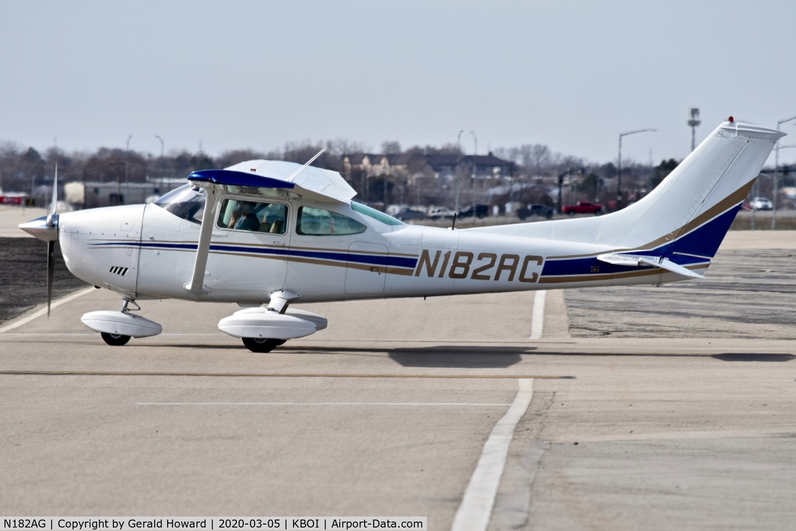 N182AG, 1973 Cessna 182P Skylane C/N 18262401, Taxiing off the north GA ramp.