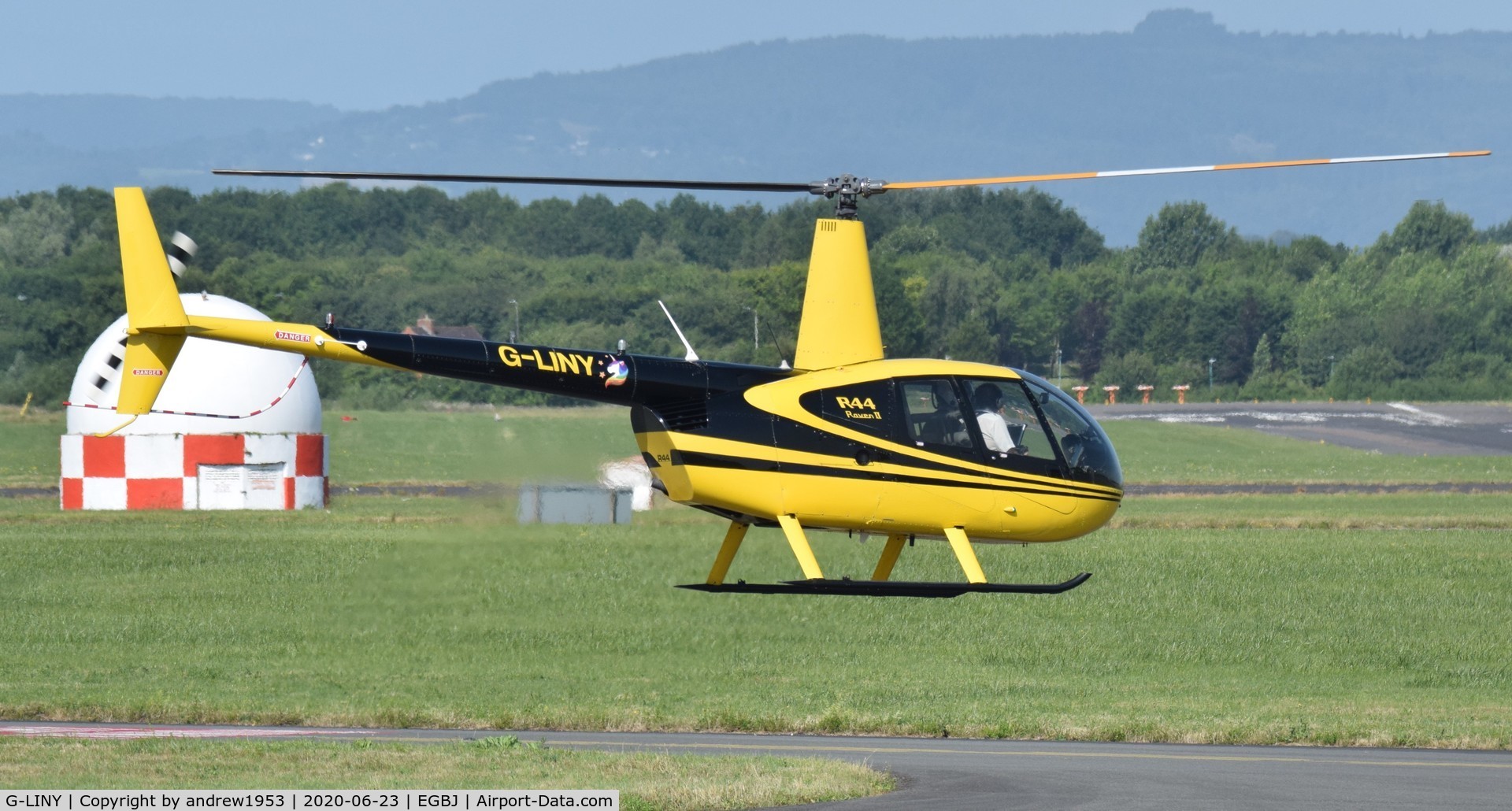 G-LINY, 2008 Robinson R44 Raven II C/N 12356, G-LINY taking off from Gloucestershire Airport.
