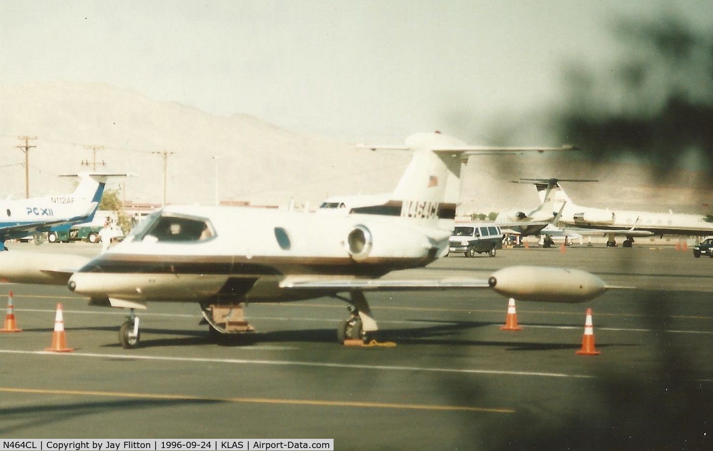 N464CL, 1966 Learjet 24A C/N 096, N464CL at KLAS. Scanned from print. Minolta X-570 with 210mm f4.2 lens. At Signature Flight Support, Las Vegas, 24-SEP-96. This was durning the NBAA  Convention.