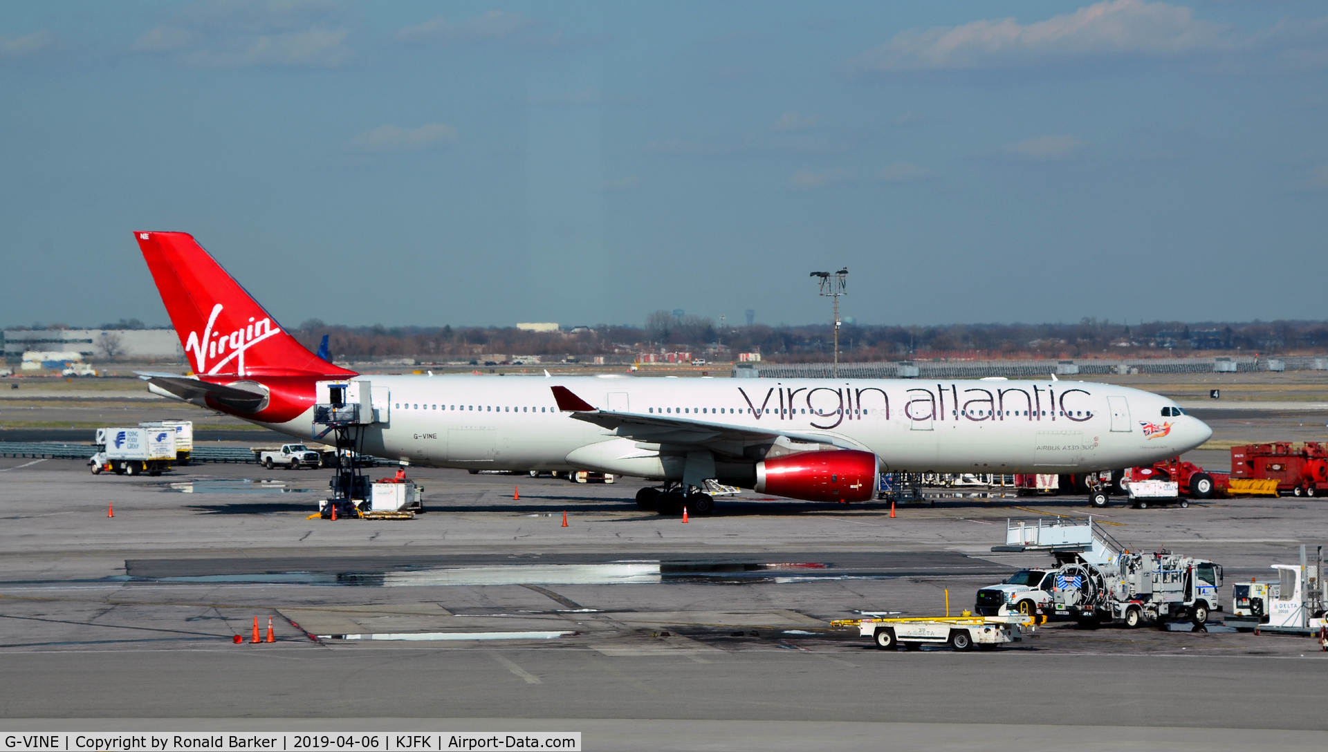 G-VINE, 2011 Airbus A330-343X C/N 1231, Parked at maintenance stand JFK  Champagne Belle