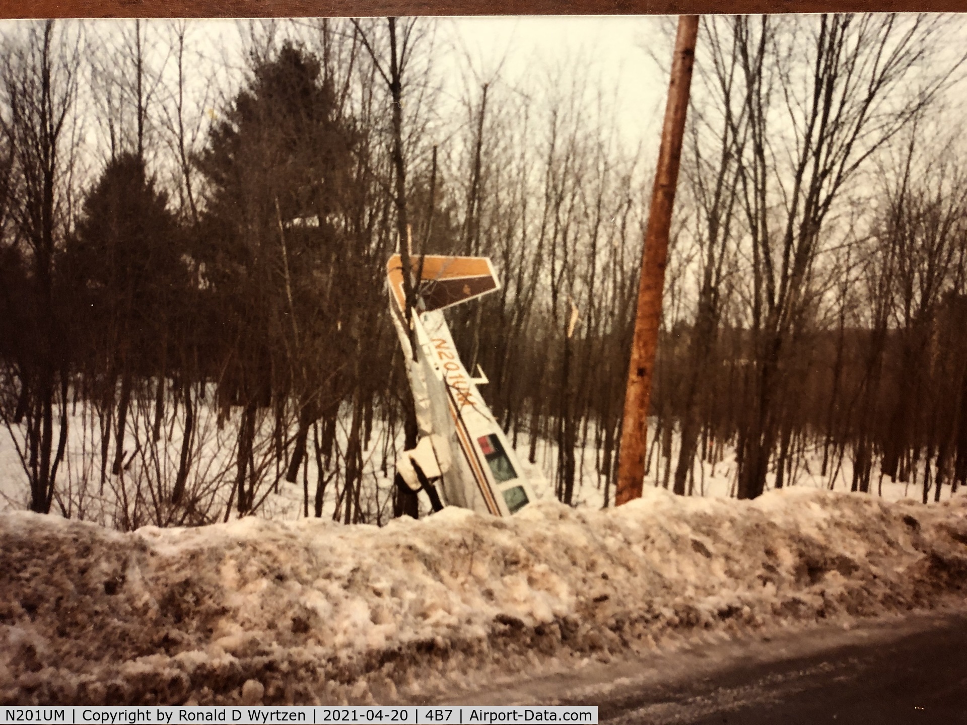 N201UM, 1977 Mooney M20J 201 C/N 24-0374, Nosed into a snowbank at Schroon Lake NY after an aborted landing at Schroon Lake, NY.  Stalled and nosed into snowbank. I don't believe the pilot was hurt.  This was in the early 80's