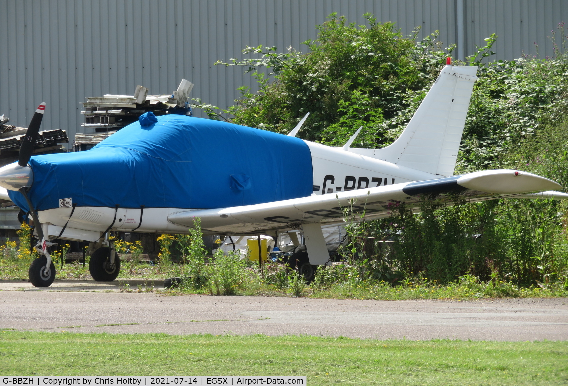 G-BBZH, 1973 Piper PA-28R-200-2 Cherokee Arrow II C/N 28R-7435102, Parked and covered at North Weald