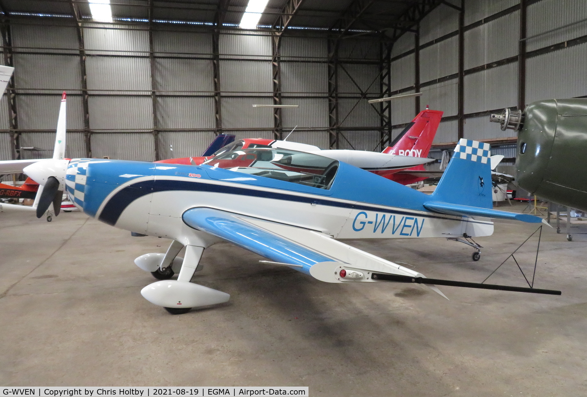 G-WVEN, 2014 Extra EA-300/200 C/N 1046, 2014 Extra safely stored in the hangar at Fowlmere, Cambs.