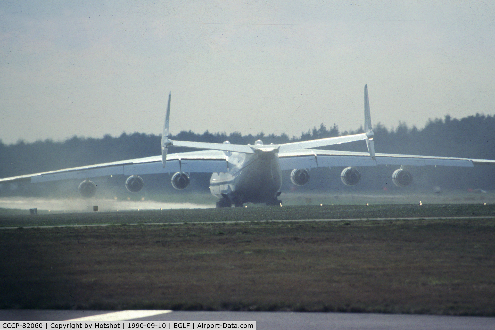 CCCP-82060, 1988 Antonov An-225 Mriya C/N 19530503763, Rollout after touchdown; a demonstration of wake turbulence due to the uplifted dirt from the grass strips