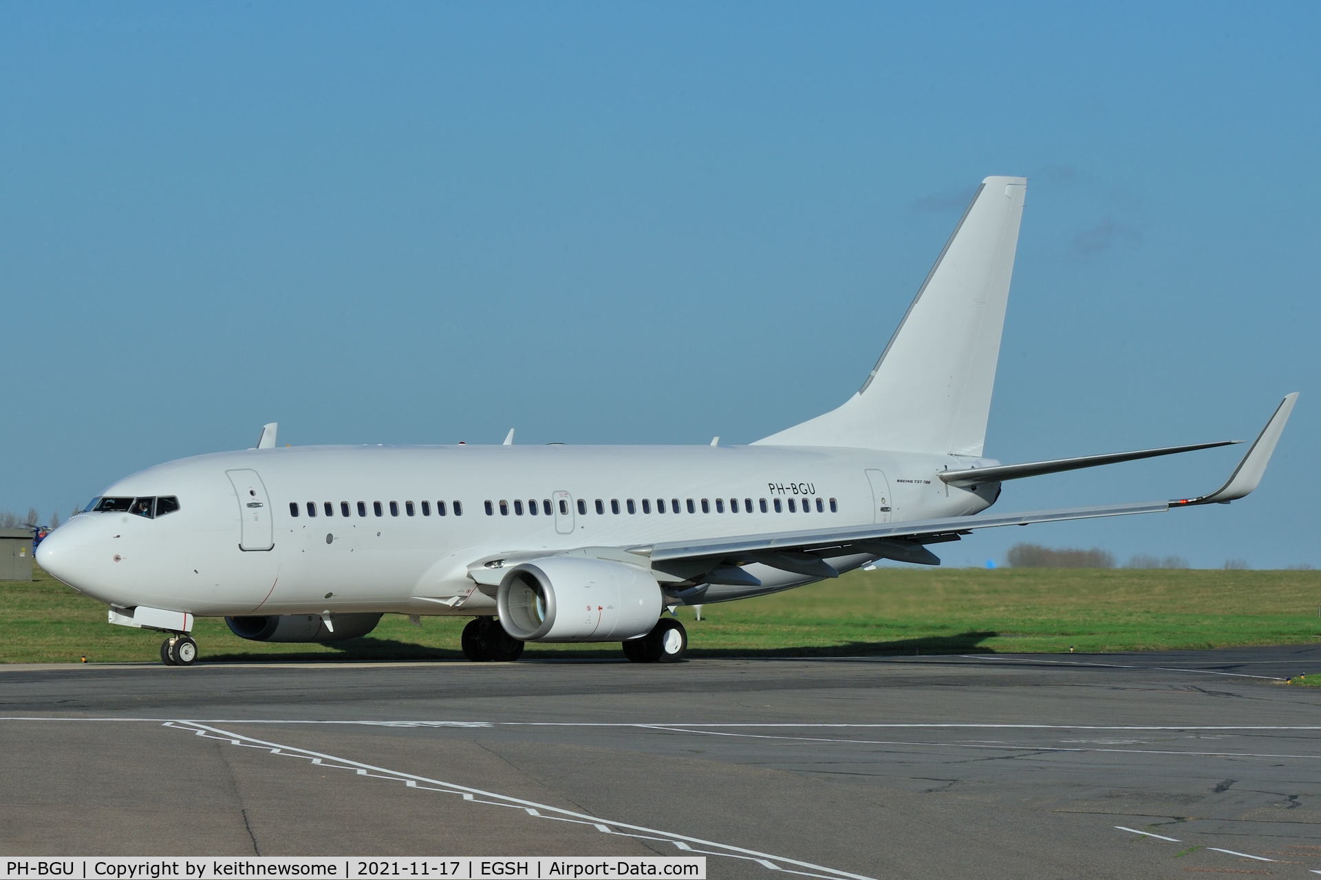 PH-BGU, 2011 Boeing 737-7K2 C/N 39257, Leaving Norwich with all over white colour scheme.