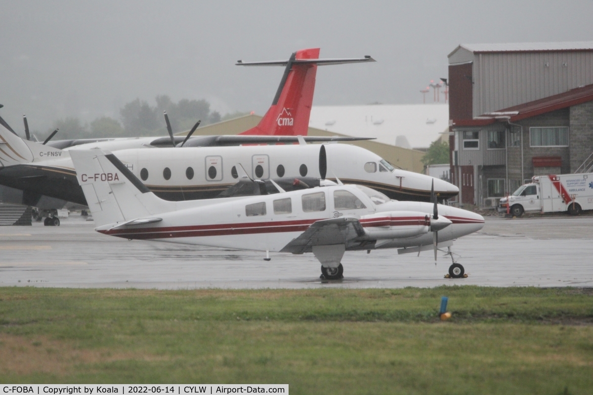 C-FOBA, 1977 Beech 58P Baron C/N TJ-107, Old lady resting at the GAT in terrible weather. First pic in the database.