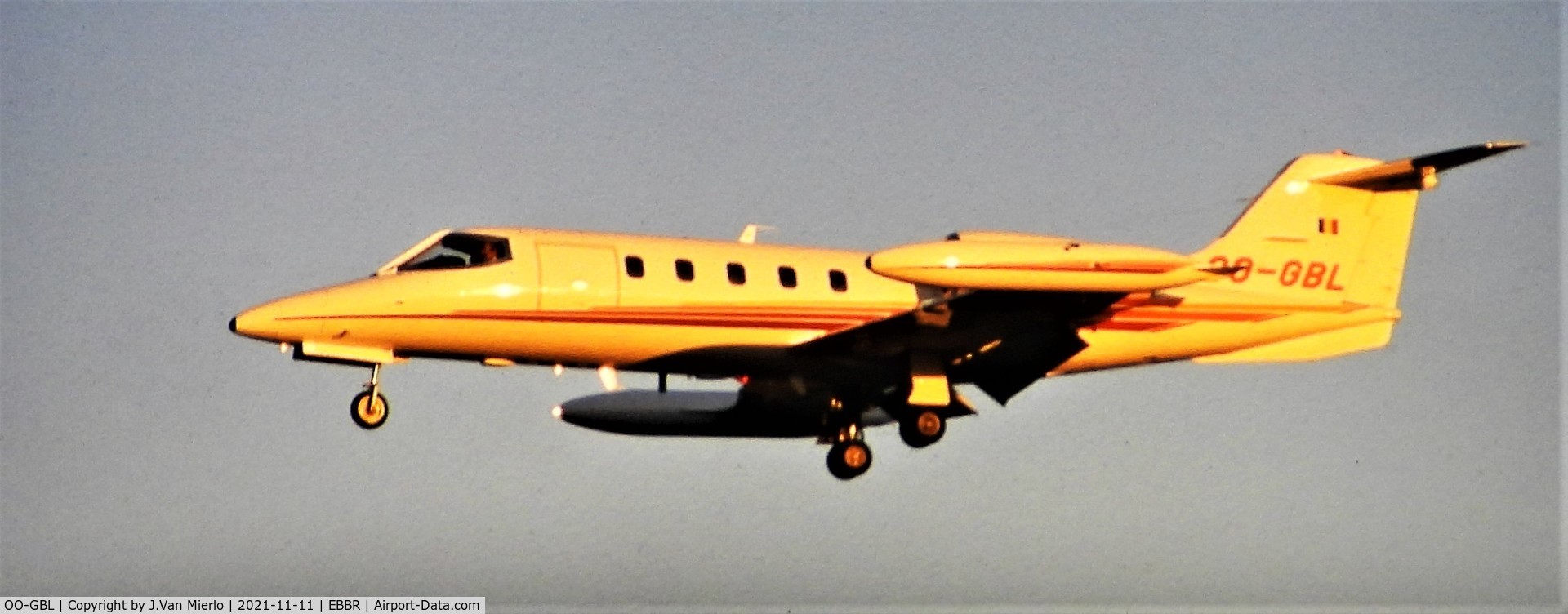 OO-GBL, 1980 Learjet 35A C/N 284, Landing at Brussels by sunset 25R slide scan