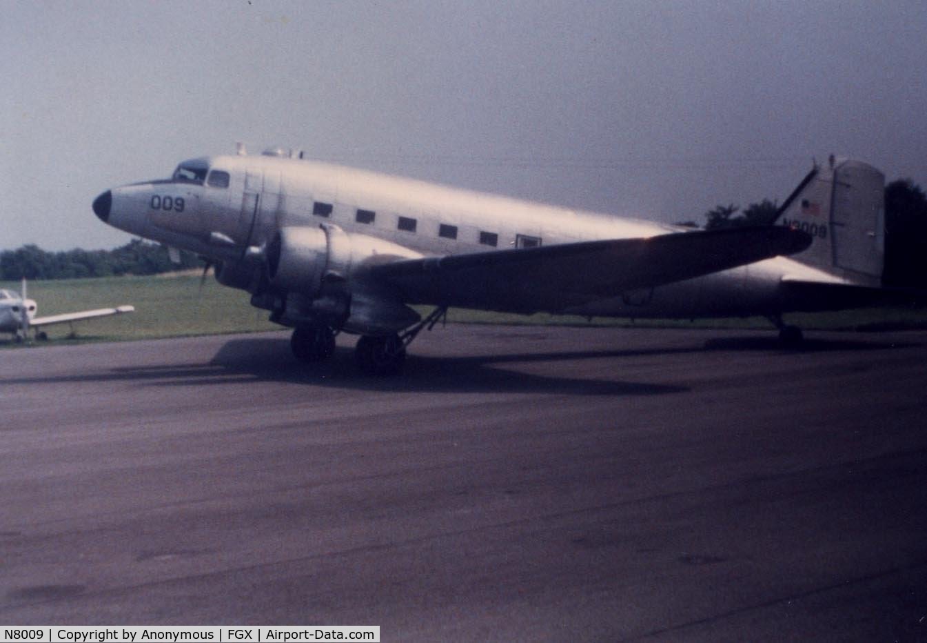 N8009, 1949 Douglas DC-3C C/N 4193, This picture was taken around 1984-85 at Fleming-Mason Airport. It would come in a few times that year and refuel.
Picture was probably taken by my mom.