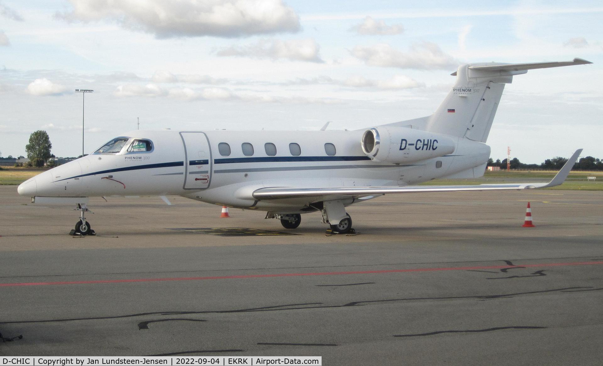 D-CHIC, 2012 Embraer EMB-505 Phenom 300 C/N 50500096, Embraer 505 Phenom 300 D-CHIC seen parked on the apron at Roskilde Airport with a 'Brakes Off' sign in the cockpit side window.