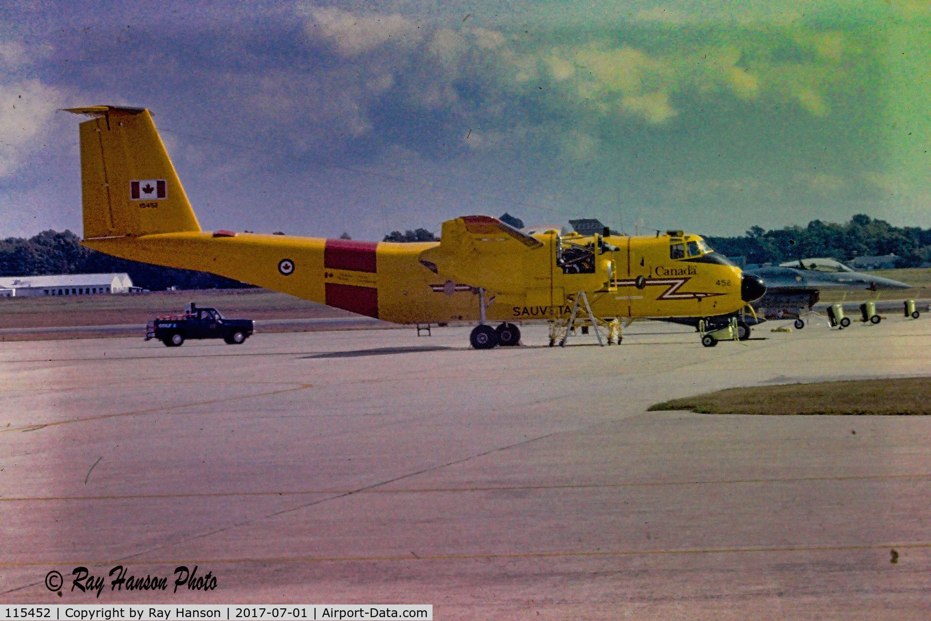 115452, 1967 De Havilland Canada CC-115 Buffalo C/N 6, Buffalo CC-115 115452 at a USAF base. Appears like its getting a prop change.