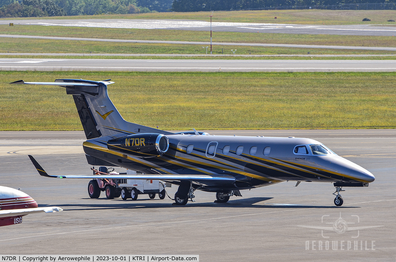 N7DR, 2015 Embraer EMB-505 Phenom 300 C/N 50500323, Parked on the ramp at Tri-Cities Airport.