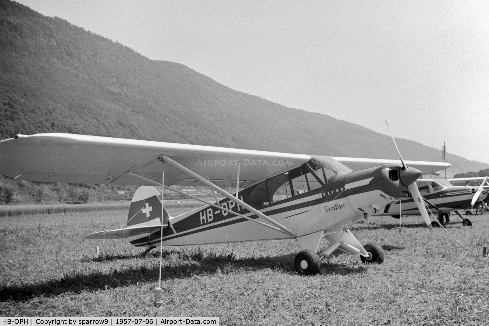 HB-OPH, 1957 Piper PA-18-150 Super Cub C/N 18-5517, A newly registered aircraft shown at Biel-boezingen airfield (closed) during the Rally de la Montre. HB-registered since 1957-04-24. Scanned from a 6x9 b/w negative.
