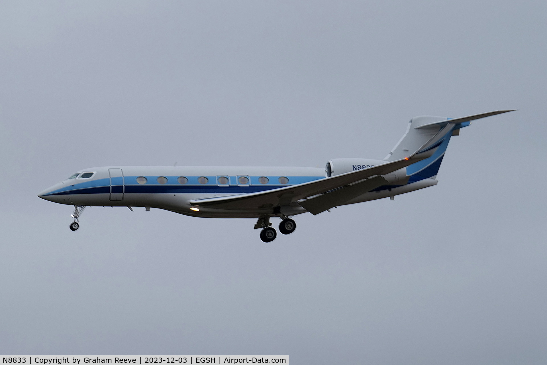 N8833, 2013 Gulfstream Aerospace G650 (G-VI) C/N 6059, Landing at Norwich on a wet, cold and misty day.