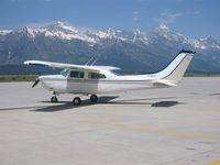 N8823H @ KJAC - 6/2002 Jackson Hole,(KJAC) Jackson Hole, Wyoming - Grand Tetons - (1970 factory paint scheme) - by Phillip Bowers