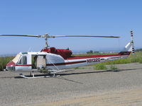 N91320 @ 07CL - Av Ag Inc. 1962 Bell UH-1B (62-1887) rigged as sprayer at their Richvale, CA base - by Steve Nation