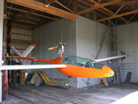 N3SX - Aircraft being serviced in hangar - by Jerry Guyer