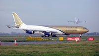 A4O-LE @ LHR - Gulf Air Airbus A340-300 (A4O-LE) taxiing at London (Heathrow) Airport. A Virgin Atlantic Boeing 747 takes off over the top. Jan 2005