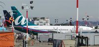 N126AT @ BFI - airTran's first 737-76N.  Not a great shot, but it was taken right after it was painted.  Probably the first picture of the aircraft in the new livery. - by Andreas Mowinckel