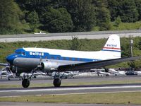 N814CL @ BFI - This DC-3 of Clay Lacy Aviation is painted in United colors and is a popular guest at airshows and other aviation arrangements.  Here on display at the Boeing Field Museum of Flight, May 2004. - by Andreas Mowinckel