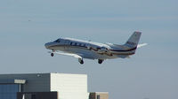 N522RA @ PDK - Departing PDK - Starting to rotate gear. - by Michael Martin