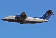 N183US @ LAX -  A rare sighting these days.  A United Express BAe-146 departing RWY 25R.