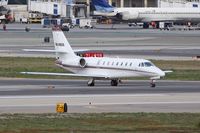 N349QS @ LAX - Taxiing across RWY 25L.