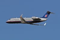 N938SW @ LAX - United Express N938SW (Bombardier CRJ-200) departing LAX RWY 25R. - by Dean Heald