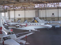 N100YB @ PDK - In Epps Air Service hanger with various other aircraft. - by Michael Martin