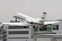 N338QS @ SMO - Cessna Citation Sovereign N338S climbing out from RWY 21 on an overcast day enroute to San Francisco International Airport (KSFO).