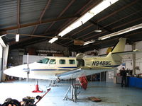 N9488C @ 0O5 - Cessna T303 on jacks at Davis Air Repair shop @ University Airport, Davis, CA - by Steve Nation