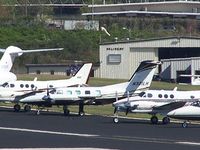 N321LH @ PDK - Long range photo - parked on 16/34 with others - by Michael Martin