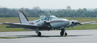 N817D @ DAN - 1975 Beech E-55 just landed with guys carrying hard hats. - by Richard T Davis