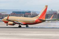 N749SW @ LAS - Southwest N749SW - 1999 Boeing 737-7H4 (FLT SWA1358) touching down on RWY 25L, concluding a 41-minute flight from Phoenix Sky Harbor Int'l (KPHX) - Phoenix, Arizona. - by Dean Heald
