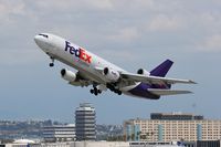 N562FE @ LAX - FedEx N562FE (FLT FDX3019) climbing out from RWY 25L enroute to Chicago Ohare Int'l (KORD), Illinois. - by Dean Heald