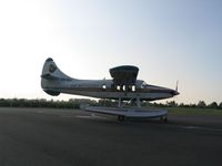 DQ-GLL @ SUV - DHC 3 Otter of Pacific Islands Seaplanes arriving at sunset - by Micha Lueck