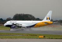 G-OZBB @ EGCC - Kicking up some spray while landing on 06L. - by Kevin Murphy