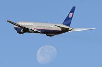 N669UA @ LAX - United Airlines N669UA climbing out from RWY 25R with the moon in the background. - by Dean Heald
