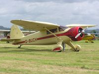 G-BUCH - Stinson sitting in the brief sunshine at Keevil - by Simon Palmer