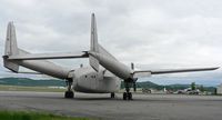 N175ML @ RDG - The silver skin of this C-119 blends in with a brooding spring sky. - by Daniel L. Berek