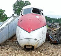 N234D @ RDG - A sad, broken DH-104 Dove stares into oblivion amid assorted aeroneutical detritus. - by Daniel L. Berek