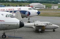 N5855V @ RDG - This Channel Wing is nestled between a Vickers Viscount and a Martin 404. - by Daniel L. Berek